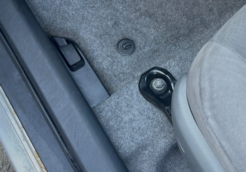 Cleaned car footwell carpet and door sill